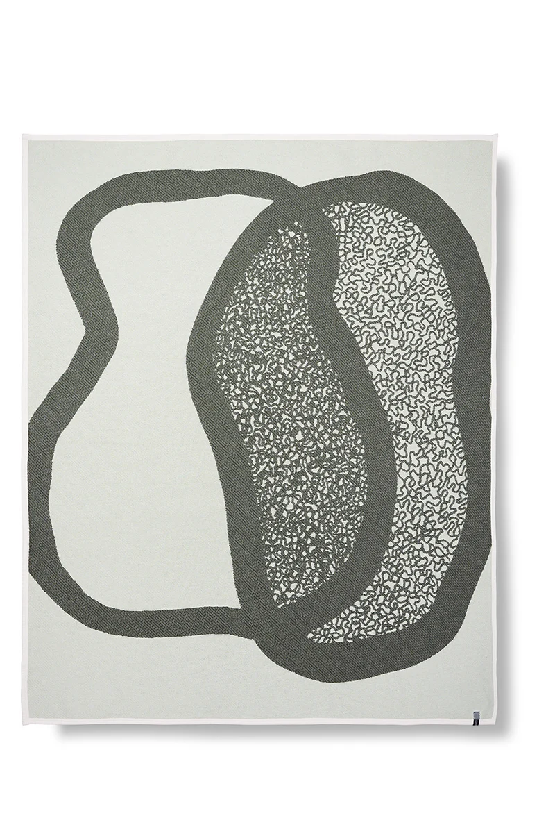 Cotton Blanket “Merging Islands” in Tea Green by Roland Schär